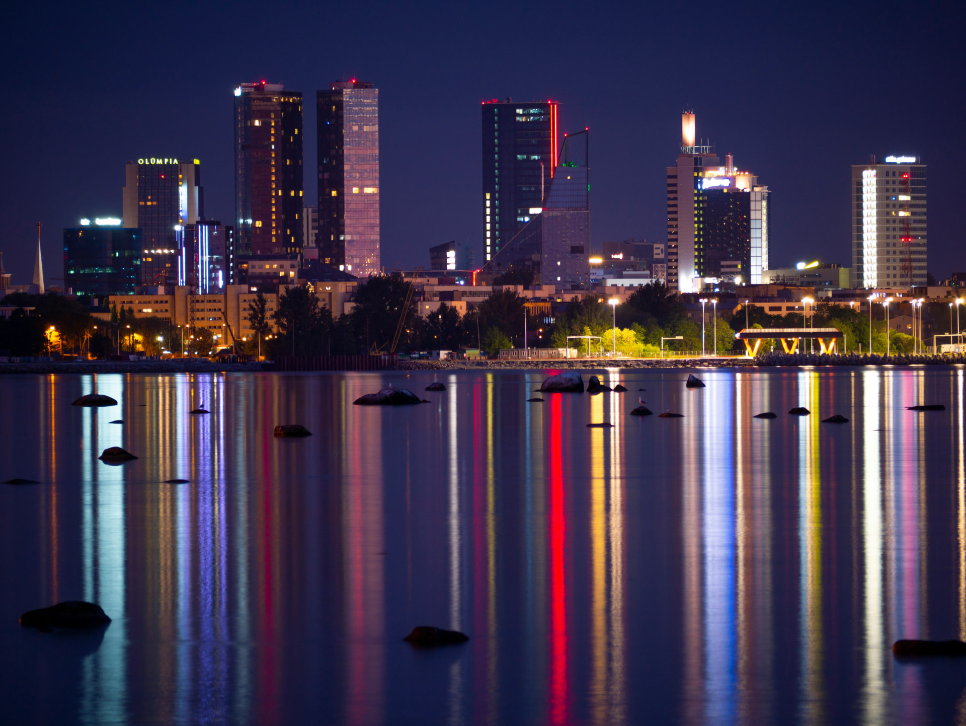 Tallinn city skyline at night with reflections on the water